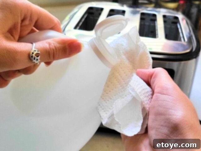 Putting vinegar on a rag