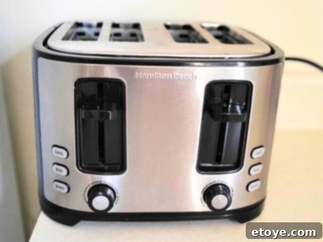 Get a Spotless Toaster Fast and Effortlessly 2 Front view of a modern toaster, showcasing its clean design