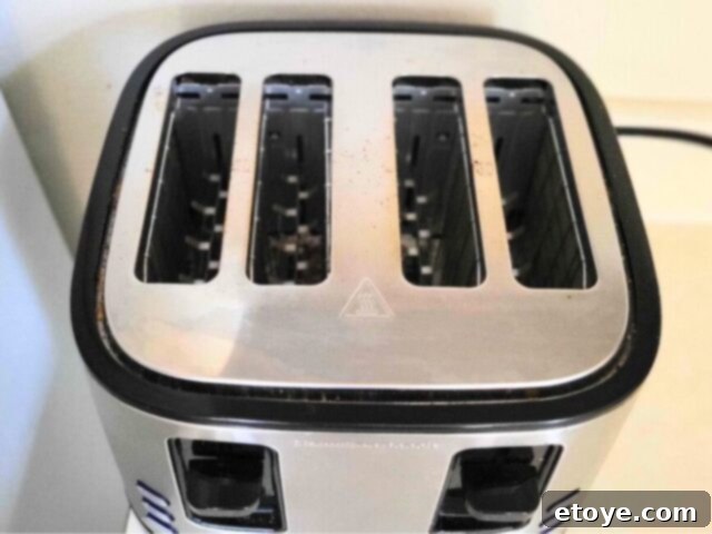 Get a Spotless Toaster Fast and Effortlessly 4 Top-down view of a toaster, highlighting its slots