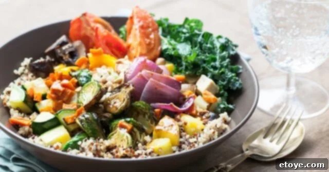 Delicious and healthy roasted vegetable Buddha Bowl with chickpeas and greens