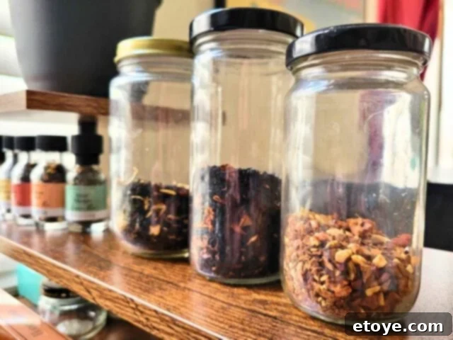 various teas in glass jars on a shelf