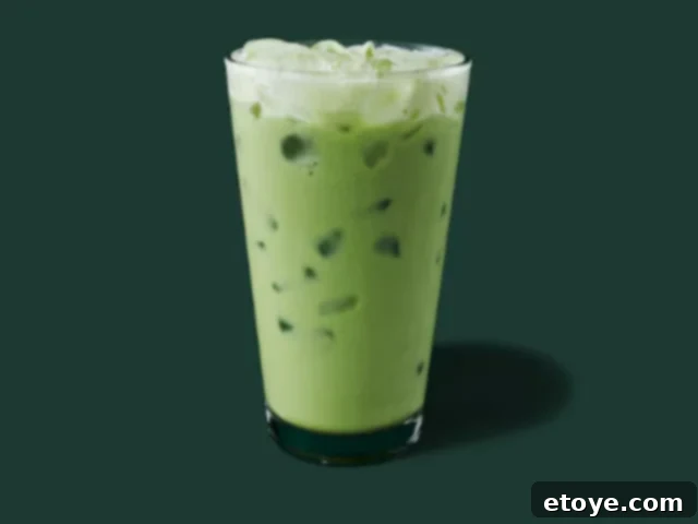 Starbucks Green Tea Matcha Latte Ingredients 2 A beautifully presented iced Starbucks matcha latte, highlighting its vibrant green color against a simple background.