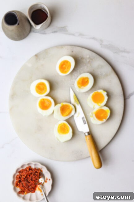 Peeling soft-boiled eggs for ramen topping