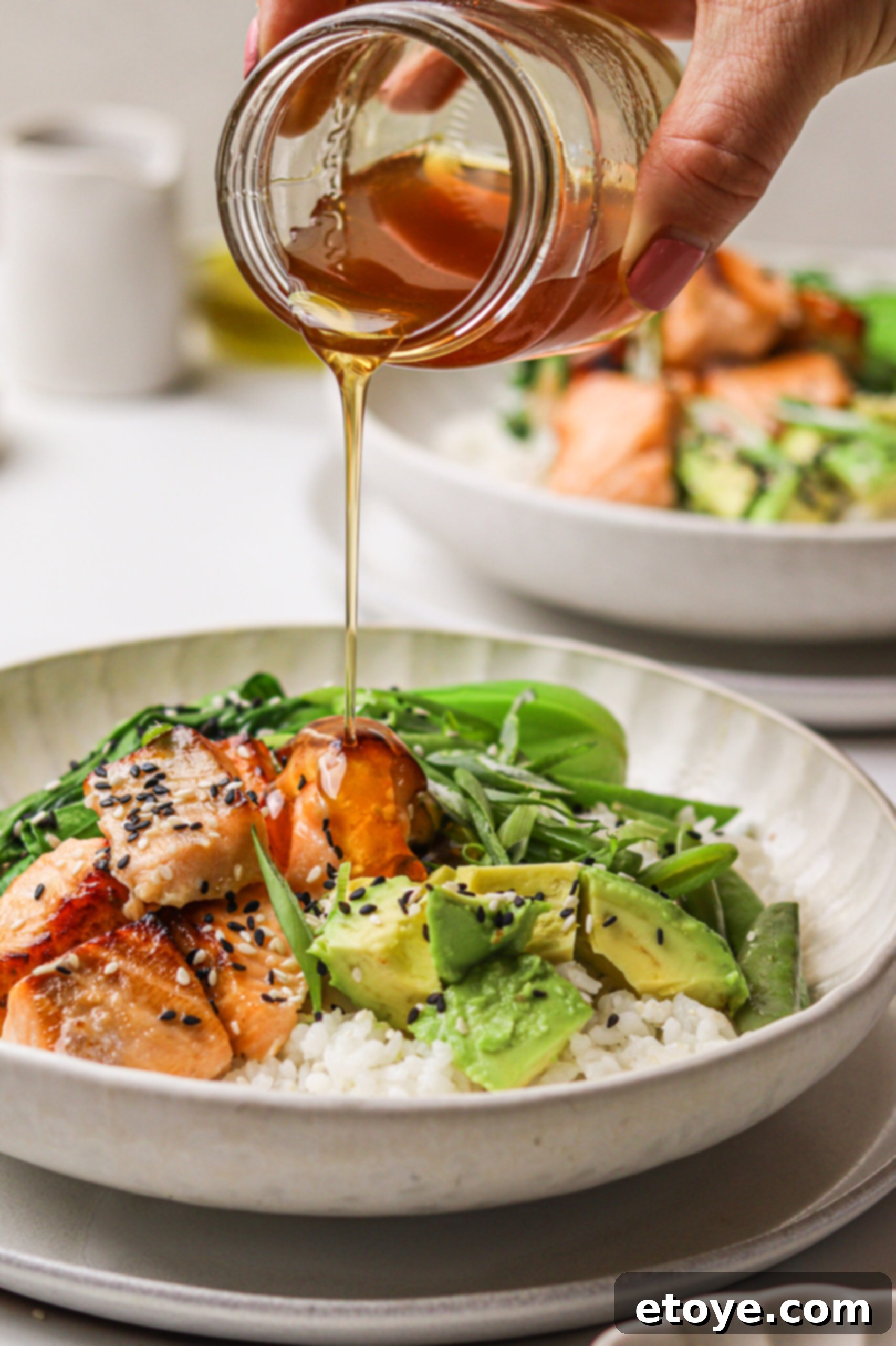 Spicy Honey Glazed Crispy Salmon Bowl 2 Hot Honey Salmon Bowl with honey drizzle