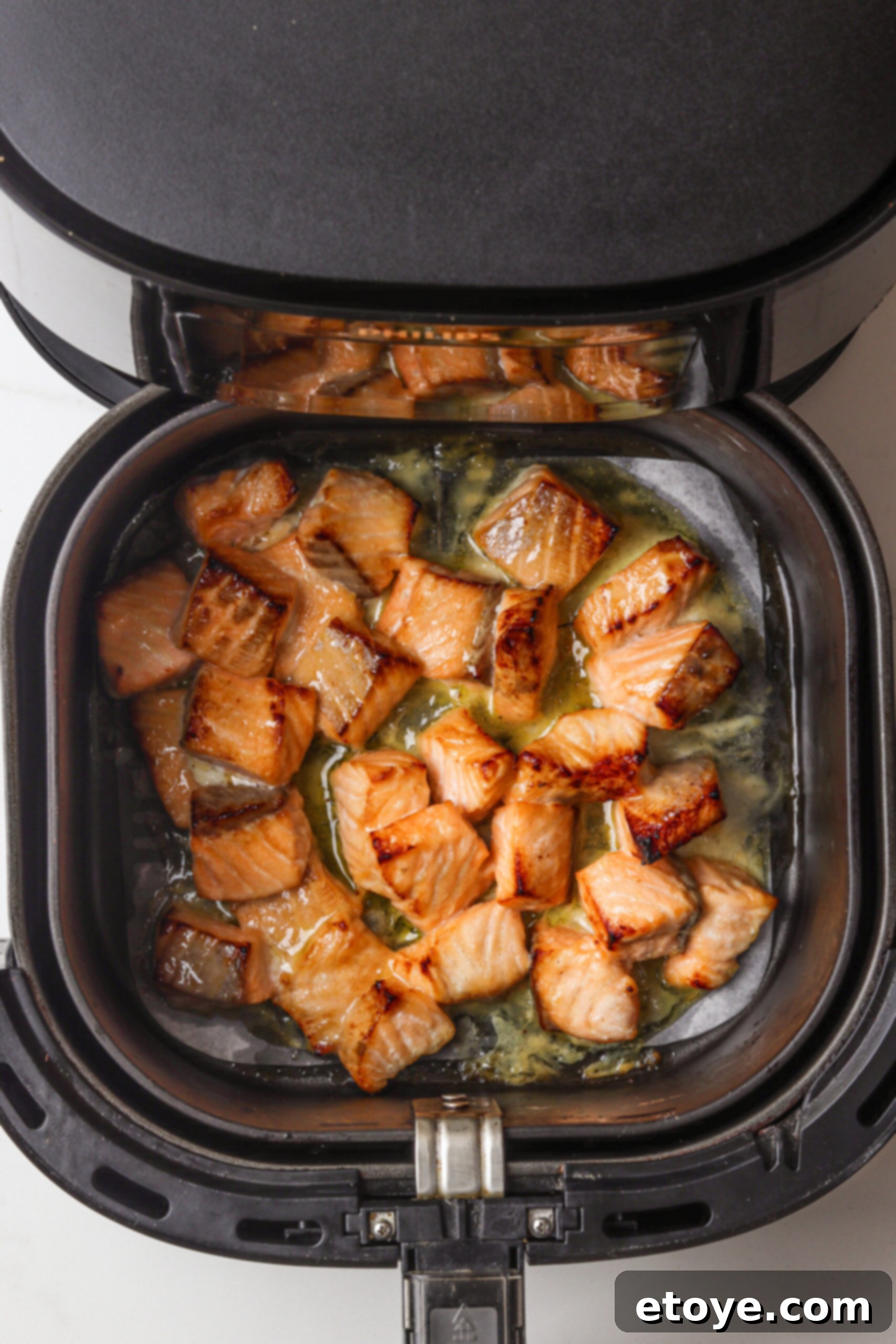 Spicy Honey Glazed Crispy Salmon Bowl 8 Glazed salmon in air fryer basket