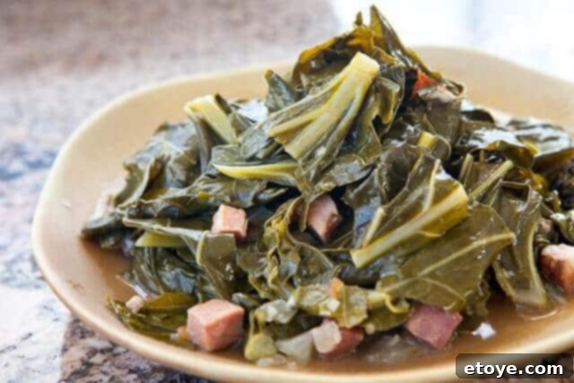 The Ultimate Guide to Fall Vegetables 11 A hearty serving of collard greens, slow-cooked with ham and smoked hock, a traditional Southern dish.