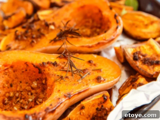 The Ultimate Guide to Fall Vegetables 12 A whole butternut squash, showcasing its smooth, pale yellow skin and classic shape.