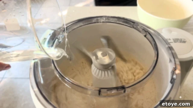 Bosch Universal Plus Kitchen Mixer Deep Dive 3 Bosch Universal Plus Kitchen Stand Mixer with a clear bowl, showing its capacity and versatility on a clean surface.