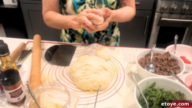Bosch Universal Plus Kitchen Mixer Deep Dive 8 Family members gathered around a table with pizza dough, enjoying a lively pizza party atmosphere.