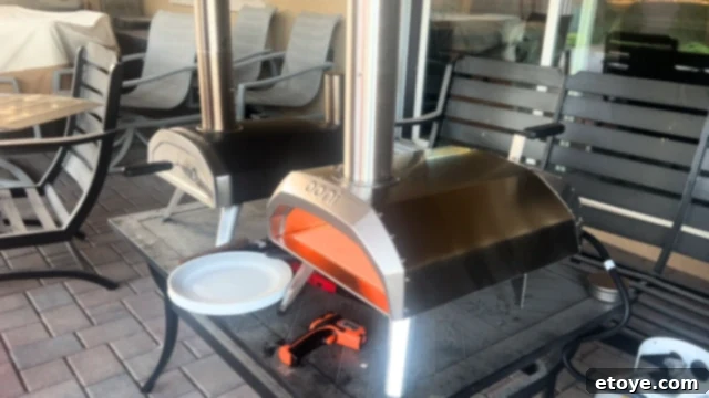 Close-up of hands stretching pizza dough, showing its elasticity and readiness for baking.