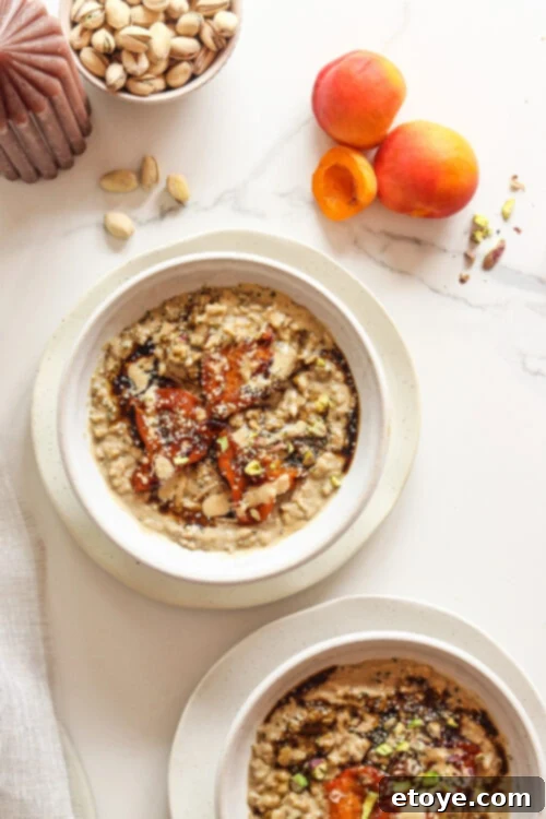 Adaptogen-Boosted Roasted Apricot Oatmeal 5 Close up of Roasted Apricot Adaptogenic Oatmeal with all toppings