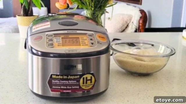 Zojirushi NP-HCC10 The Best Rice Cooker Evaluated 3 Shiny new Zojirushi rice cooker on a kitchen counter
