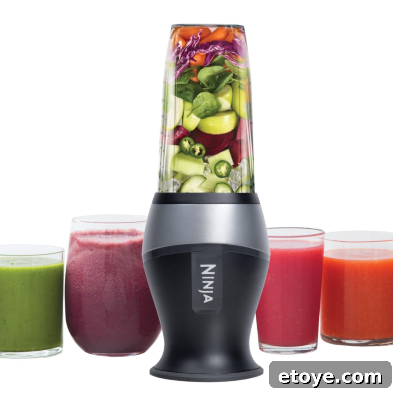 Two Ninja Fit Blender cups, one with a blended smoothie and the other empty, ready for use