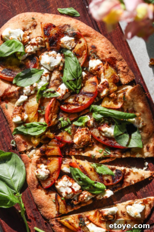 Delicious Grilled Peach, Basil & Goat Cheese Flatbread ready to serve