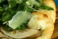 No Knead Pear Gorgonzola Flatbread Topped with Arugula and Parmesan