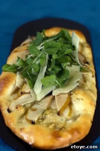 No Knead Pear Gorgonzola Flatbread Topped with Arugula and Parmesan 2 Homemade Pear and Gorgonzola Flatbread Baking