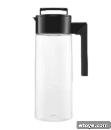 Mighty Leaf Iced Tea giveaway items: a selection of four tea boxes, a Takeya flash brew pitcher, and a Takeya glass water bottle