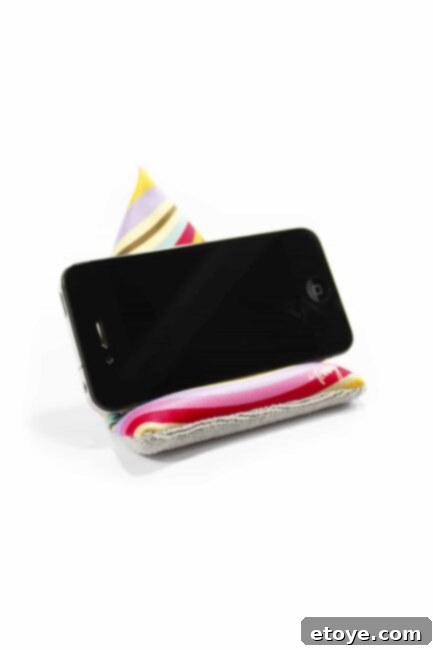 Toddy Wedge propping up an iPhone on a surface