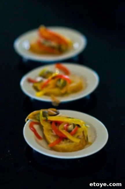 Stephanie Izard Presenting Mussels Escabeche Chef Stephanie Izard proudly presenting her exquisite Steamed Mussel and Fennel Escabeche dish.