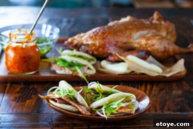 roasted Duck recipe and Chinese Steamed Buns on table