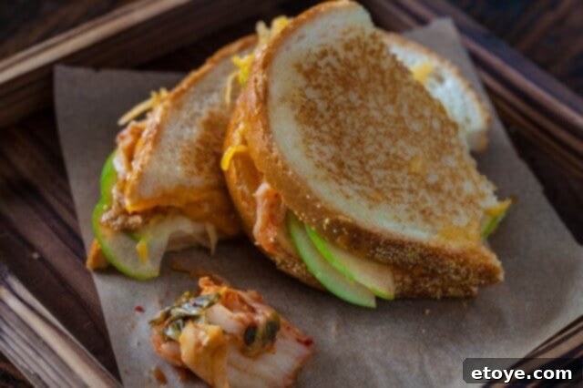 Kimchi Krunch Melt 2 Delicious grilled kimcheese sandwiches served on a plate