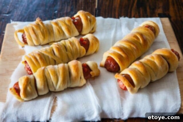 Mummy Halloweenies Ready to Serve Close-up of baked Mummy Halloweenies on a baking sheet