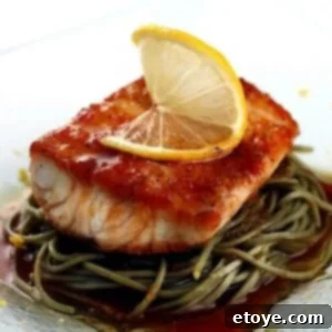 Close-up of a serving of Citrus-Soy Fish with Soba Noodles in a bowl.