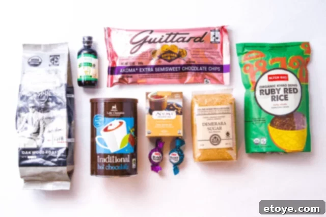 Assortment of Fair Trade baking ingredients like coffee, chocolate, vanilla, and sugar, ready for holiday baking