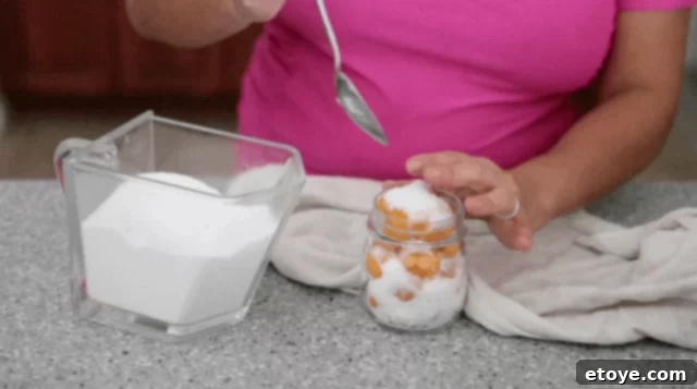 Chinese Salted Kumquat Preserve 4 pouring salt into mason jar