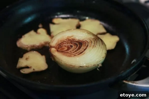 crockpot pho vietnamese beef noodle soup recipe Grilling onion and ginger for Crockpot Pho