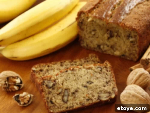 Moist Walnut Banana Bread 3 Banana bread with walnuts on wood