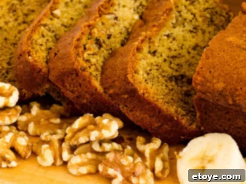 Moist Walnut Banana Bread 4 Slices banana bread with walnuts and slices bananas