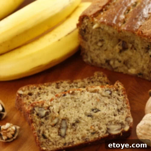 Moist Walnut Banana Bread 5 Banana bread with walnuts on wood