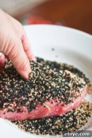 Sesame Seared Tuna with Lime Ginger Vinaigrette -step-004 Sesame Seared Tuna step 4: Coat with sesame seeds