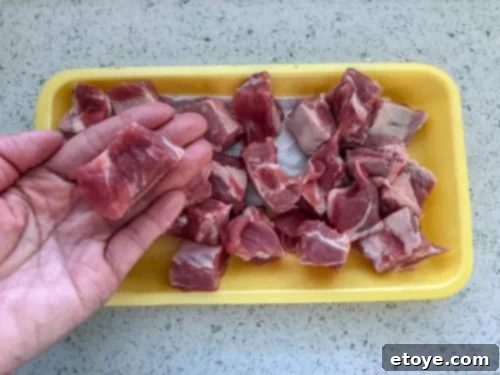 Delicious Chinese Sweet and Sour Spare Ribs Recipe 4 Cutting pork spare ribs into individual rib tips with kitchen shears