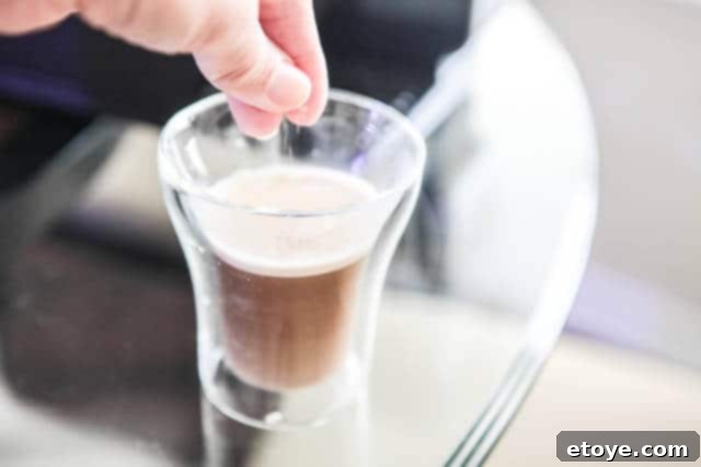 Score a Nespresso Lattissima Espresso Machine 6 Adding Demerara Sugar to Espresso