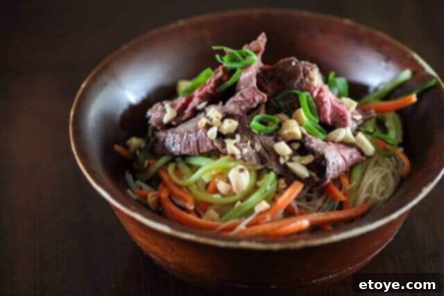 Delicious Asian Rice Noodle Salad with Grilled Steak and Fresh Vegetables