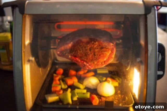 Prime Rib Roast Recipe - Rotisserie in action Rotisserie oven with prime rib roast cooking