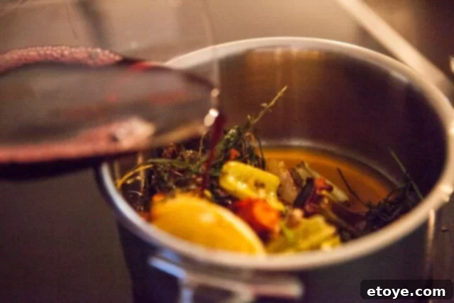 Prime Rib Roast Recipe - Adding Red Wine Saucepan with pan drippings and red wine