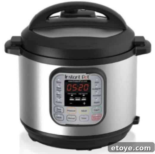 Instant Pot Electric Pressure Cooker with a stack of delicious food, showcasing its multi-functional capabilities