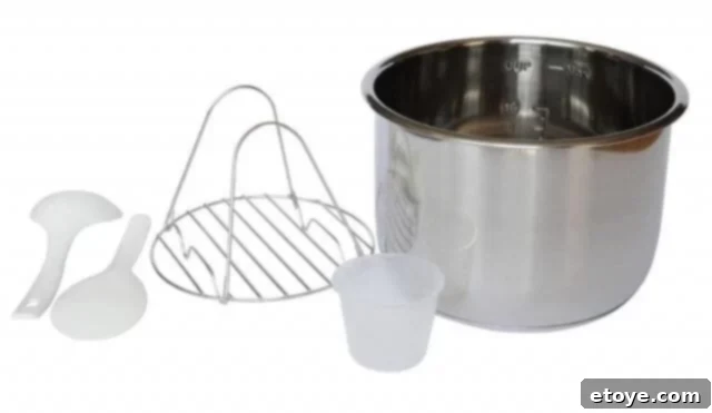 Instant Pot accessories laid out, including a steamer rack, rice paddle, measuring cup, and ladle