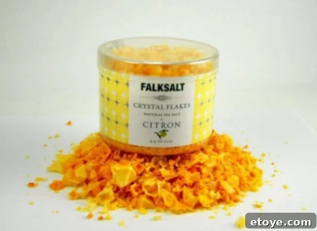 Falksalt Review Taste Test and Giveaway 4 Falksalt Citron sea salt flakes on a cutting board with lemon