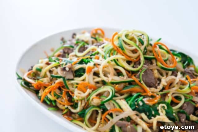 Score an Inspiralizer! 4 Healthy and colorful Korean Japchae with zucchini noodles prepared using an Inspiralizer
