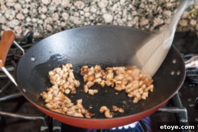 Tossing Chicken in Wok chicken fried rice recipe - chicken