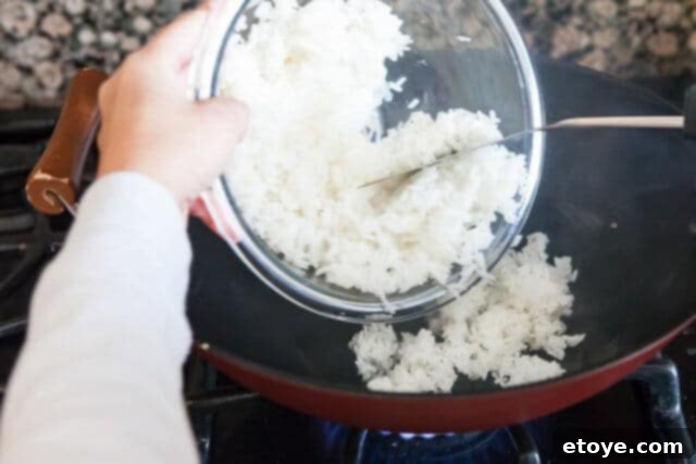 Adding Rice to Wok chicken fried rice recipe - add rice