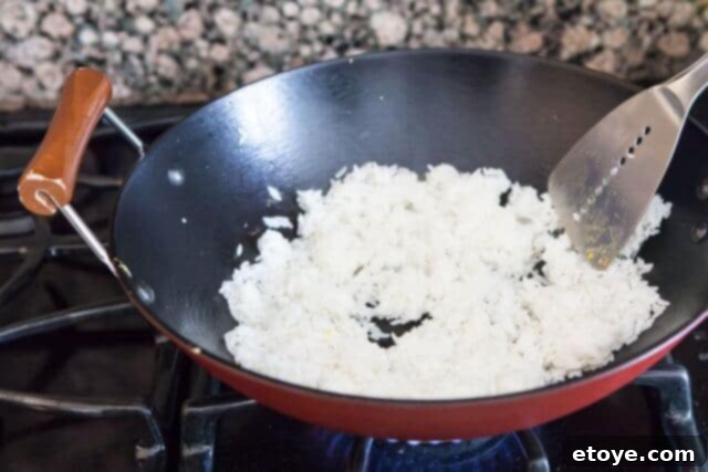 Stir-frying Rice chicken fried rice recipe - add rice