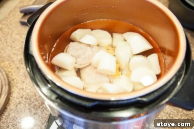 A pressure cooker filled with Chinese Daikon Soup ingredients, simmering to perfection, illustrating one of the versatile cooking methods.