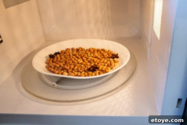 Second microwave roast for the batch of peanuts, changing color.