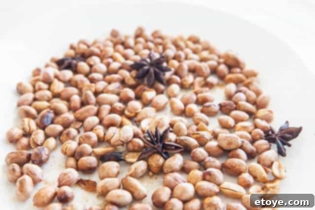 Close-up of golden brown roasted peanuts ready to cool.