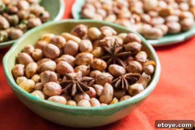Bowl of Chinese five spice roasted peanuts, a warm and aromatic snack.